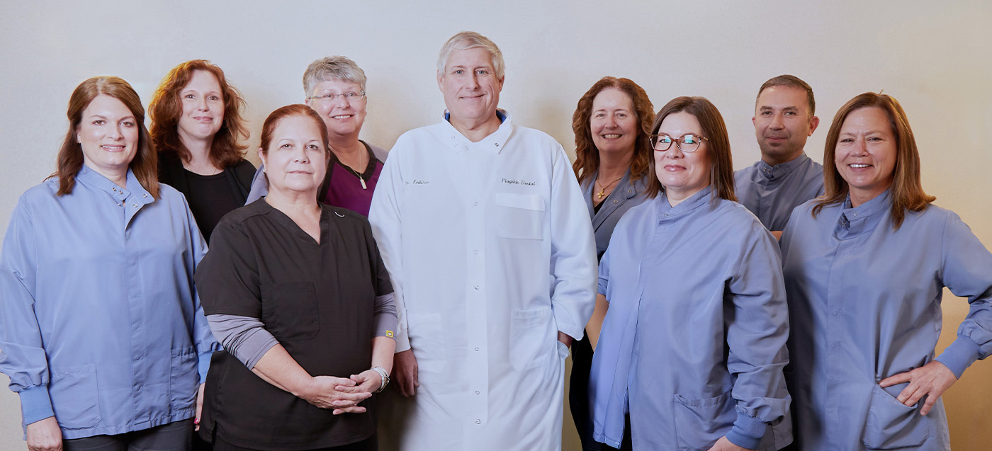Smiling dentists and team members at Flagship Dental Group